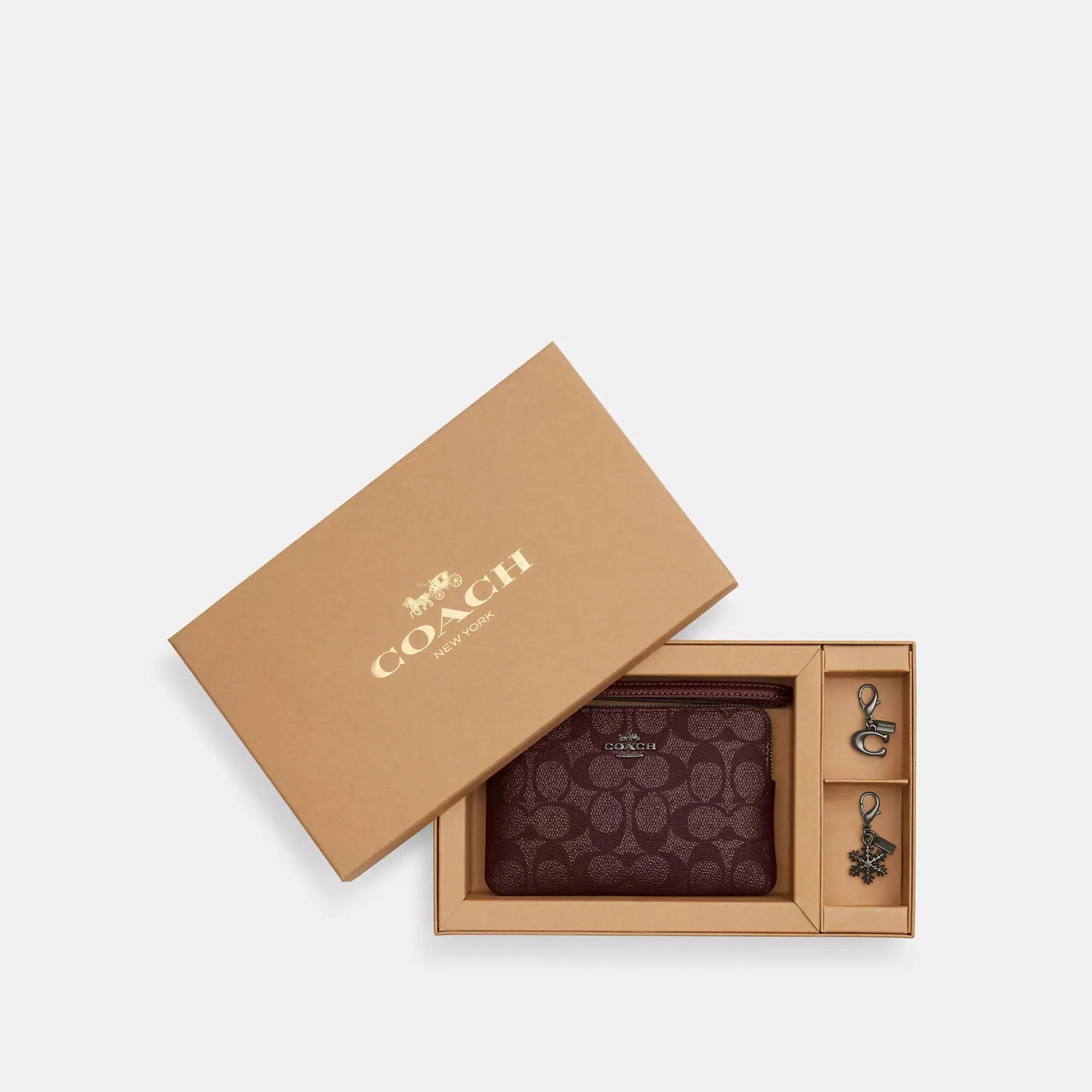 Coach Outlet Boxed Corner Zip Wristlet In Signature Canvas With Charms